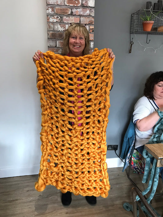 Handmade arm knitting blanket.